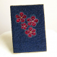 Quilted book cover w/ applique flowers.