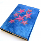 Quilted book cover w/ felt stars.  Quilted book cover w/ felt stars.